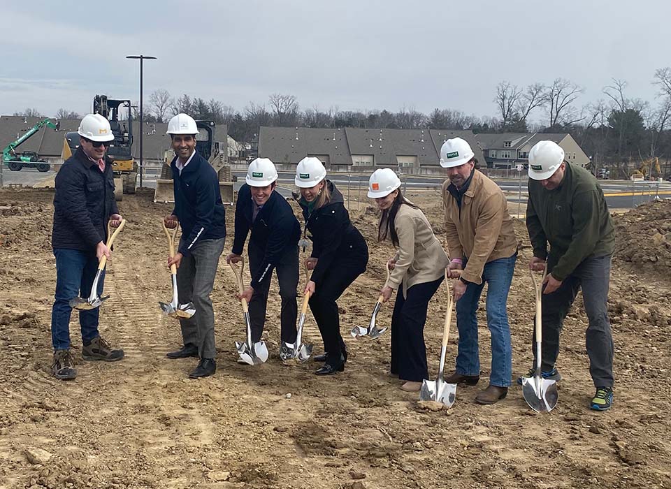 group of people breaking ground for new Ashburn office