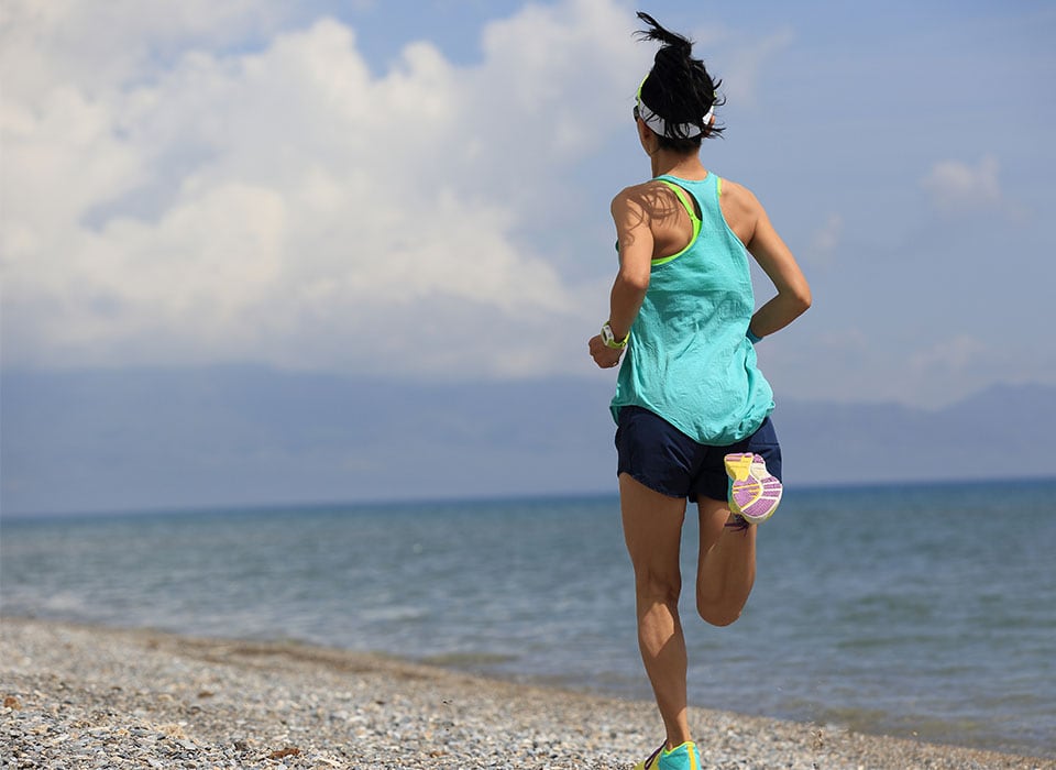 woman running on beach