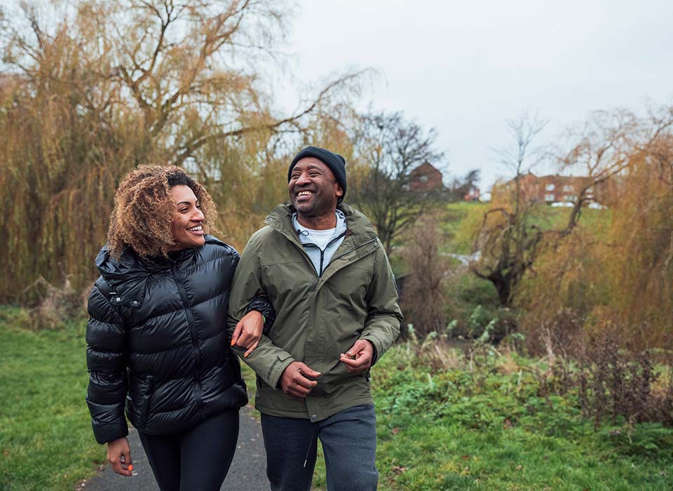 older couple walking outdoors