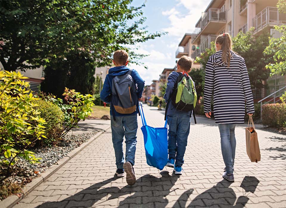 kids carrying groceries