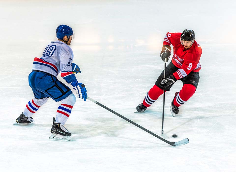 men playing ice hockey