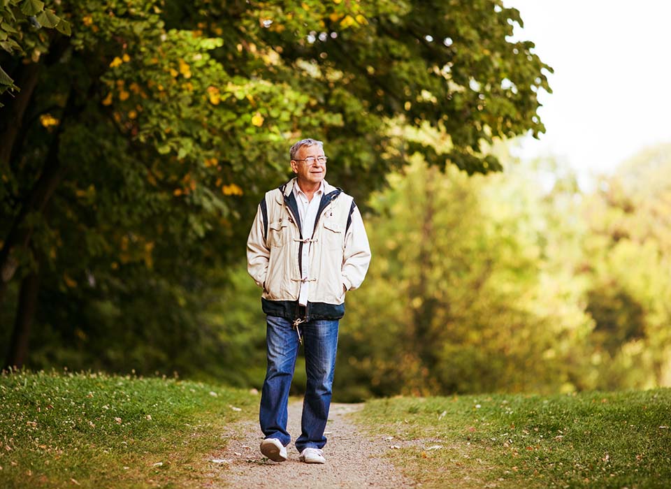 man walking on a nature trail