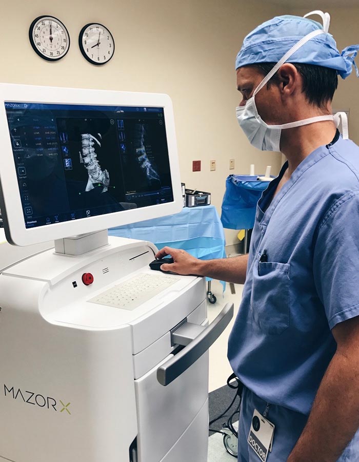 Dr. Herzog in an operatory room with surgical equipment