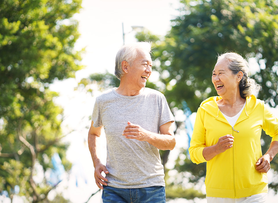 man and woman walking outside for exericse
