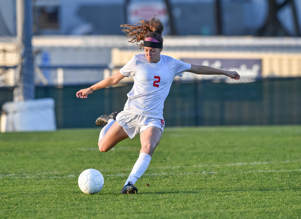 soccer player about to kick a soccer ball