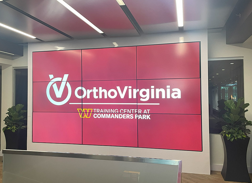 large sign with OrthoVirginia Training Center at Commanders Park logo