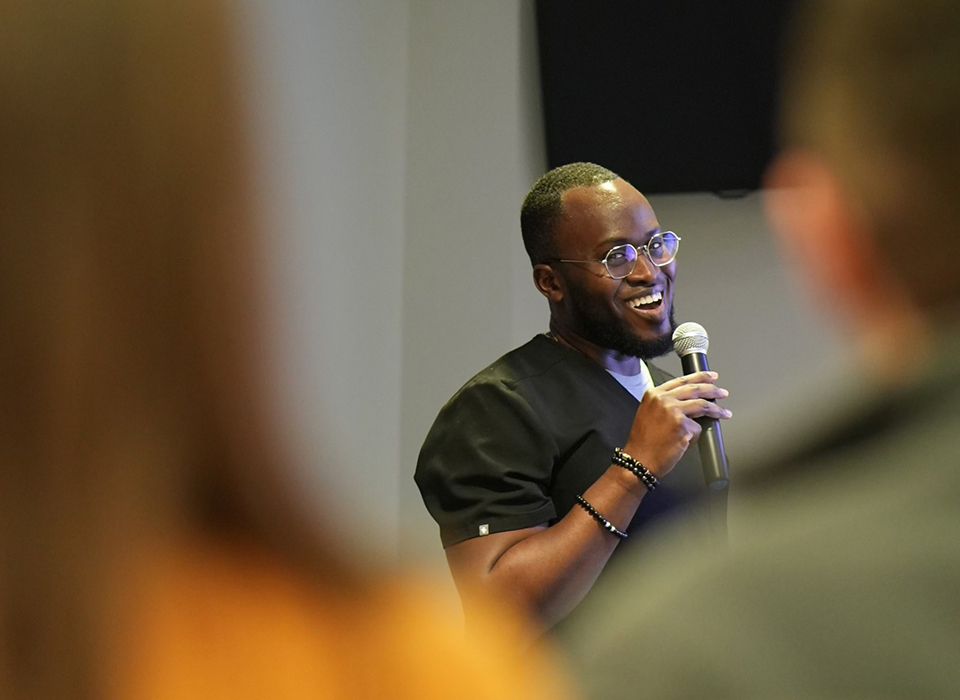 Dr. Owusu-Akyaw speaking into a microphone