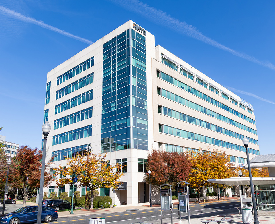 outside of Arlington PT and OT, a white and glass building about 8 stories tall